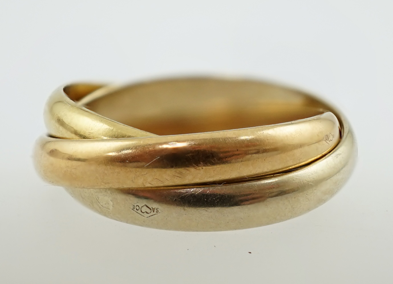 A modern French Cartier three colour 18k gold 'Russian' wedding ring